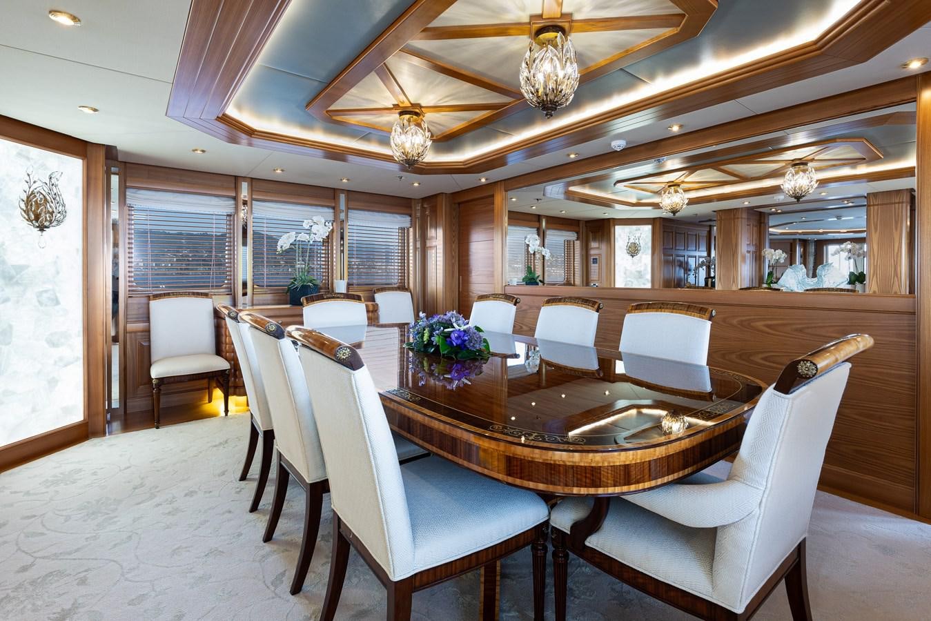 a dining room with a table and chairs aboard VIBRANCE Yacht for Sale
