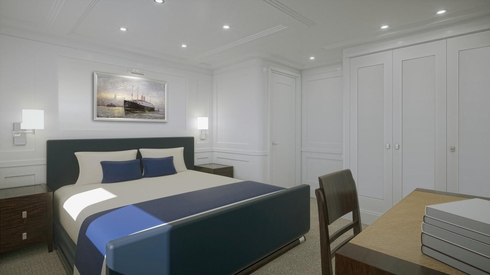 a bedroom with a bed and a desk aboard PROJECT MARLIN Yacht for Sale