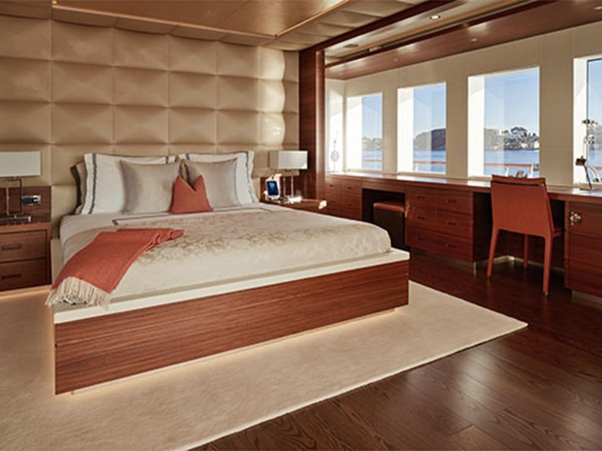 a large bed in a room aboard NASSIMA Yacht for Sale