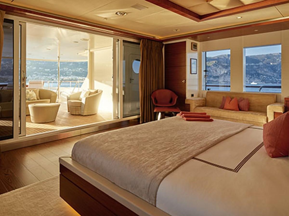 a bedroom with a large bed aboard NASSIMA Yacht for Sale