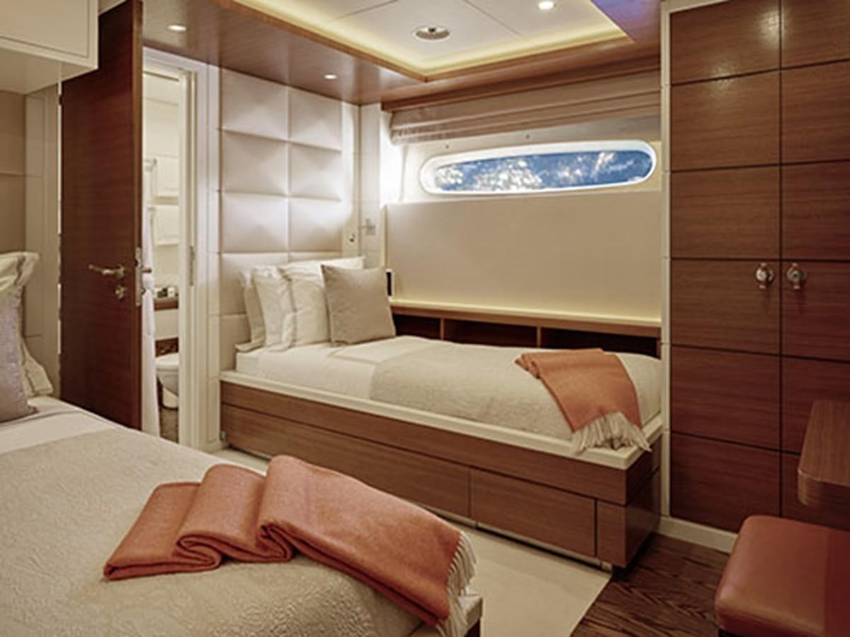 a room with a bed and a closet aboard NASSIMA Yacht for Sale