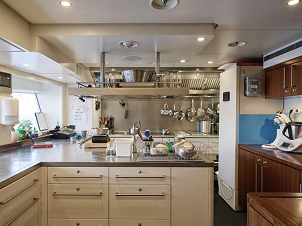 a kitchen with a lot of clutter aboard NASSIMA Yacht for Sale