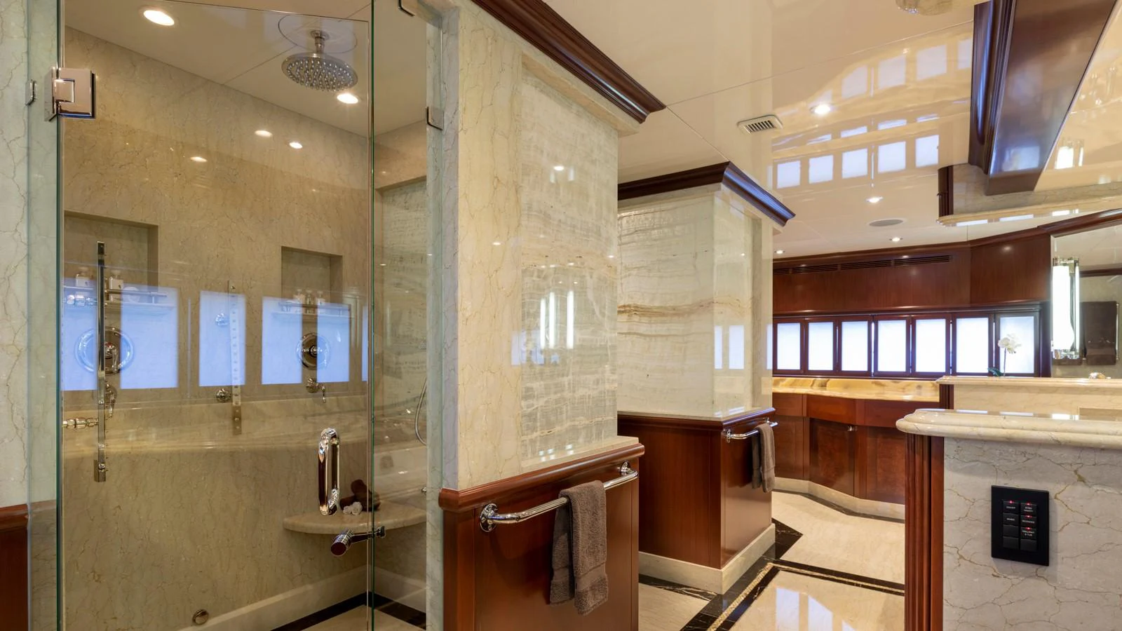a bathroom with a glass shower aboard GLAZE Yacht for Sale