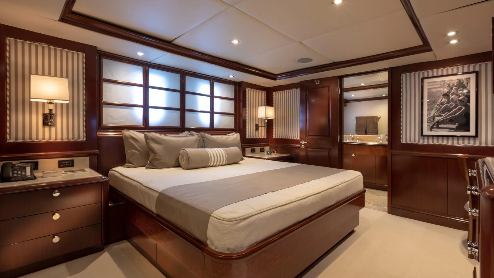 a bedroom with a bed and a desk aboard GLAZE Yacht for Sale