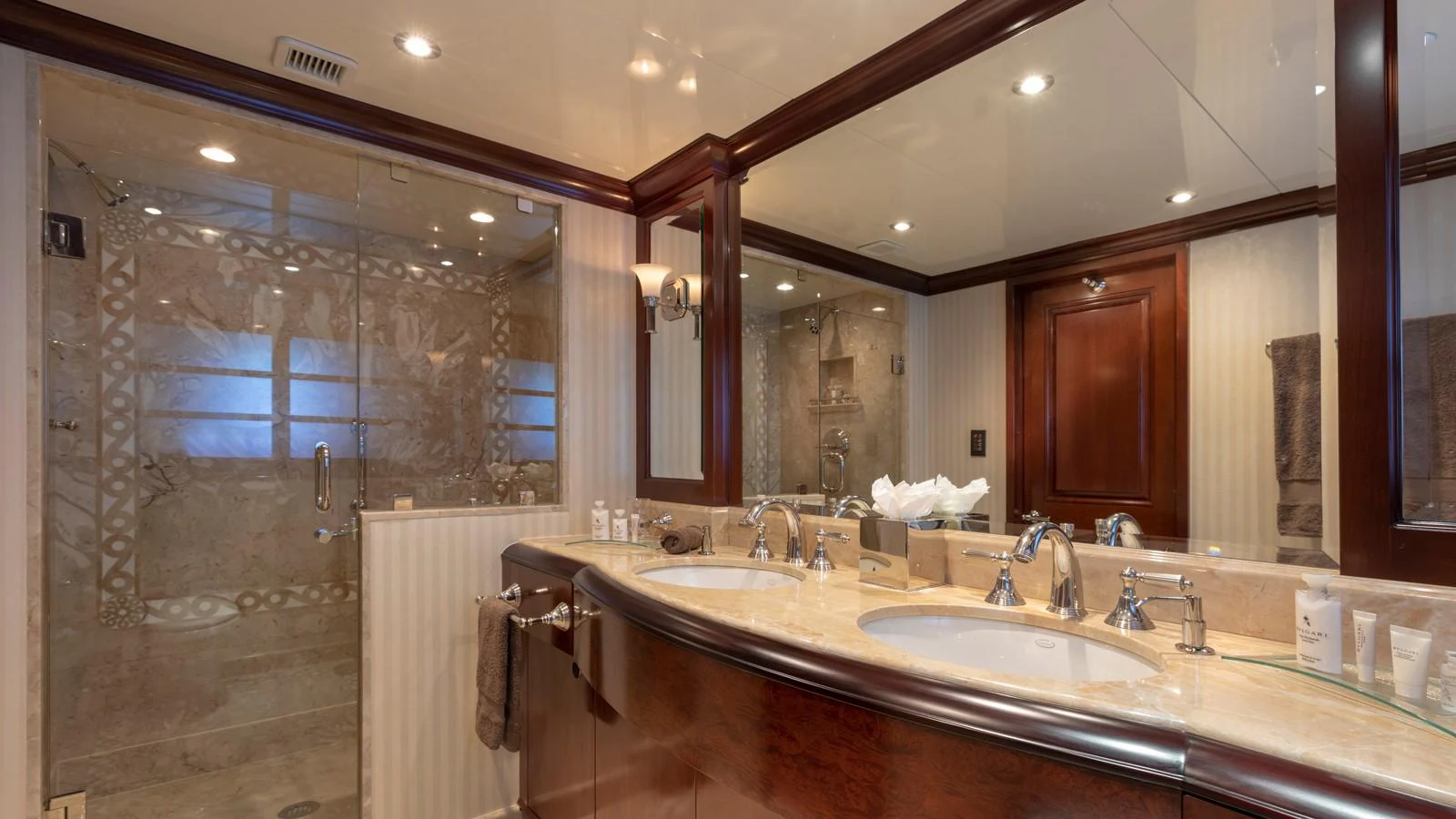 a bathroom with a large mirror aboard GLAZE Yacht for Sale