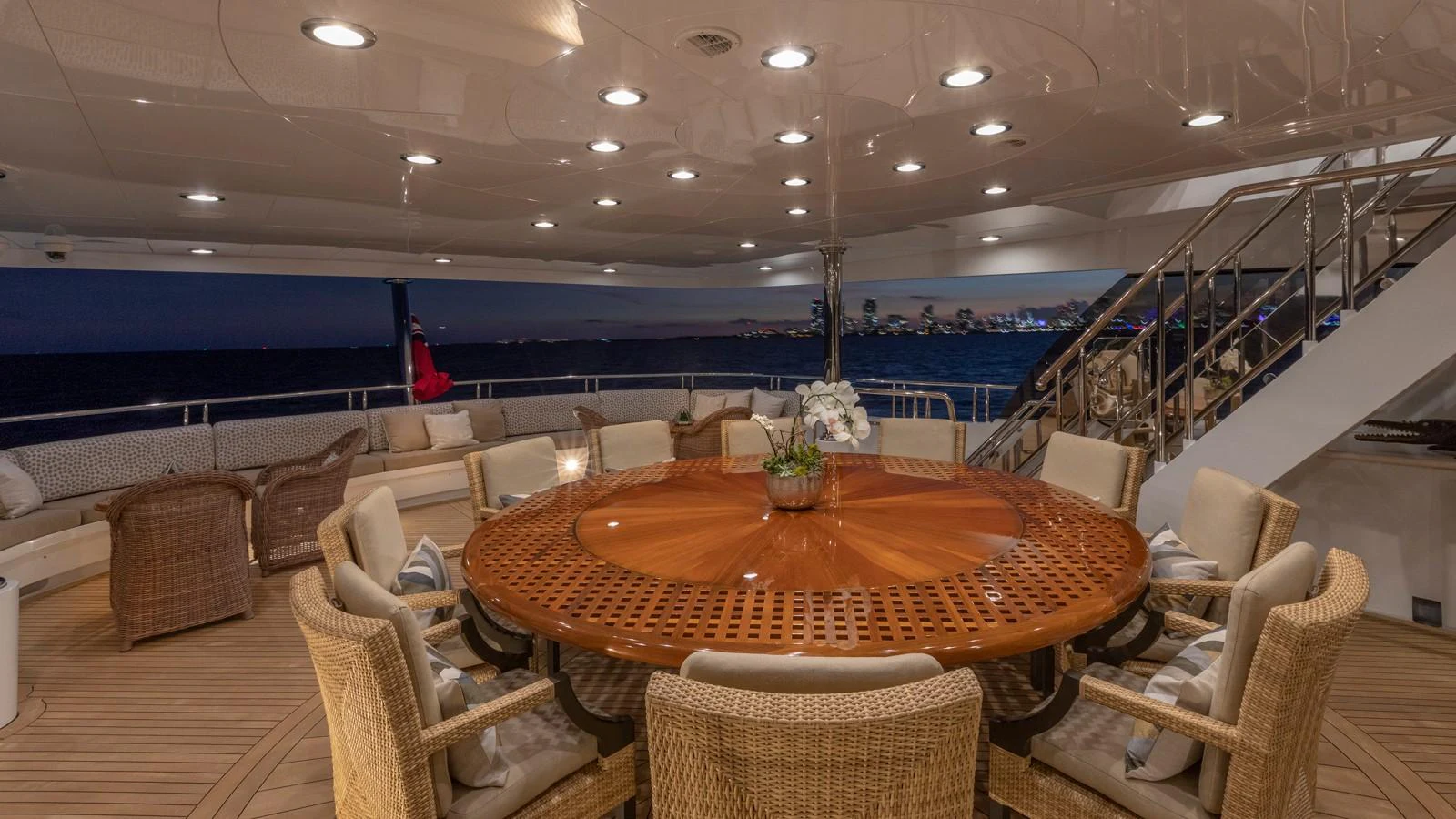 a large room with a table and chairs and a large pool aboard GLAZE Yacht for Sale