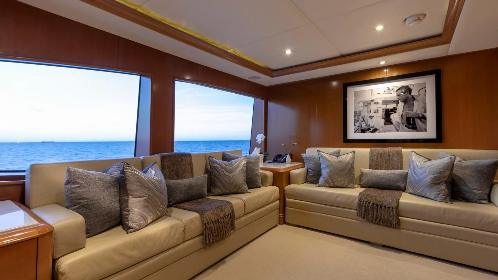 a living room with a large window aboard GLAZE Yacht for Sale