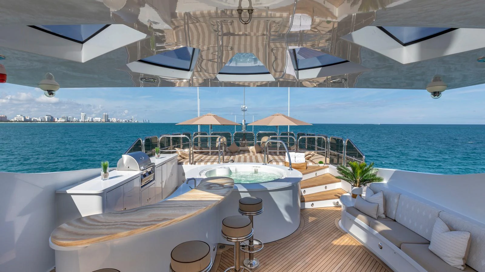a room with a table and chairs aboard GLAZE Yacht for Sale