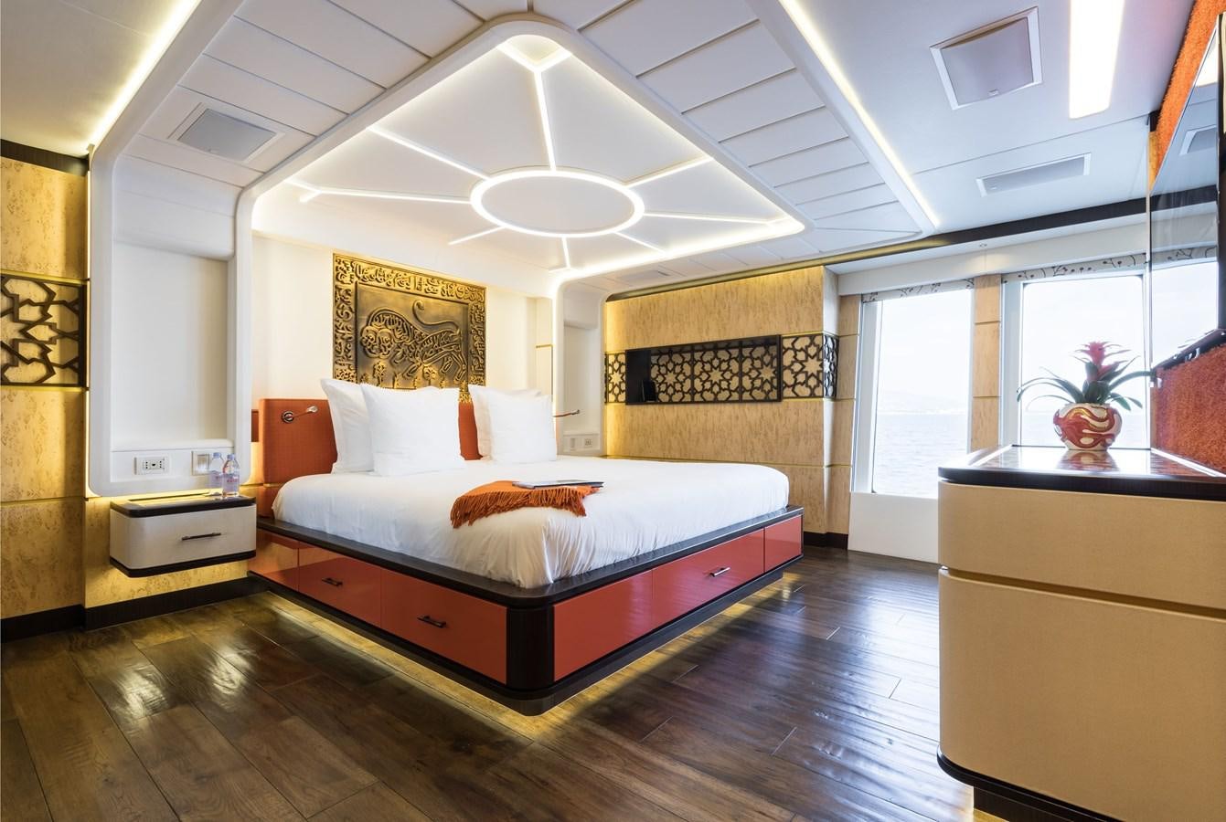 a bedroom with a large bed aboard KHALILAH Yacht for Charter