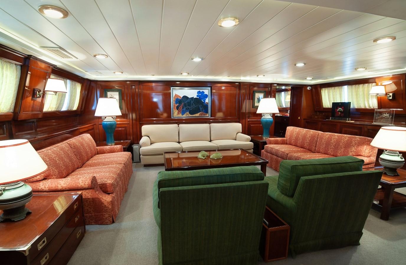 a living room with a couch and a table aboard BELLE BRISE Yacht for Sale