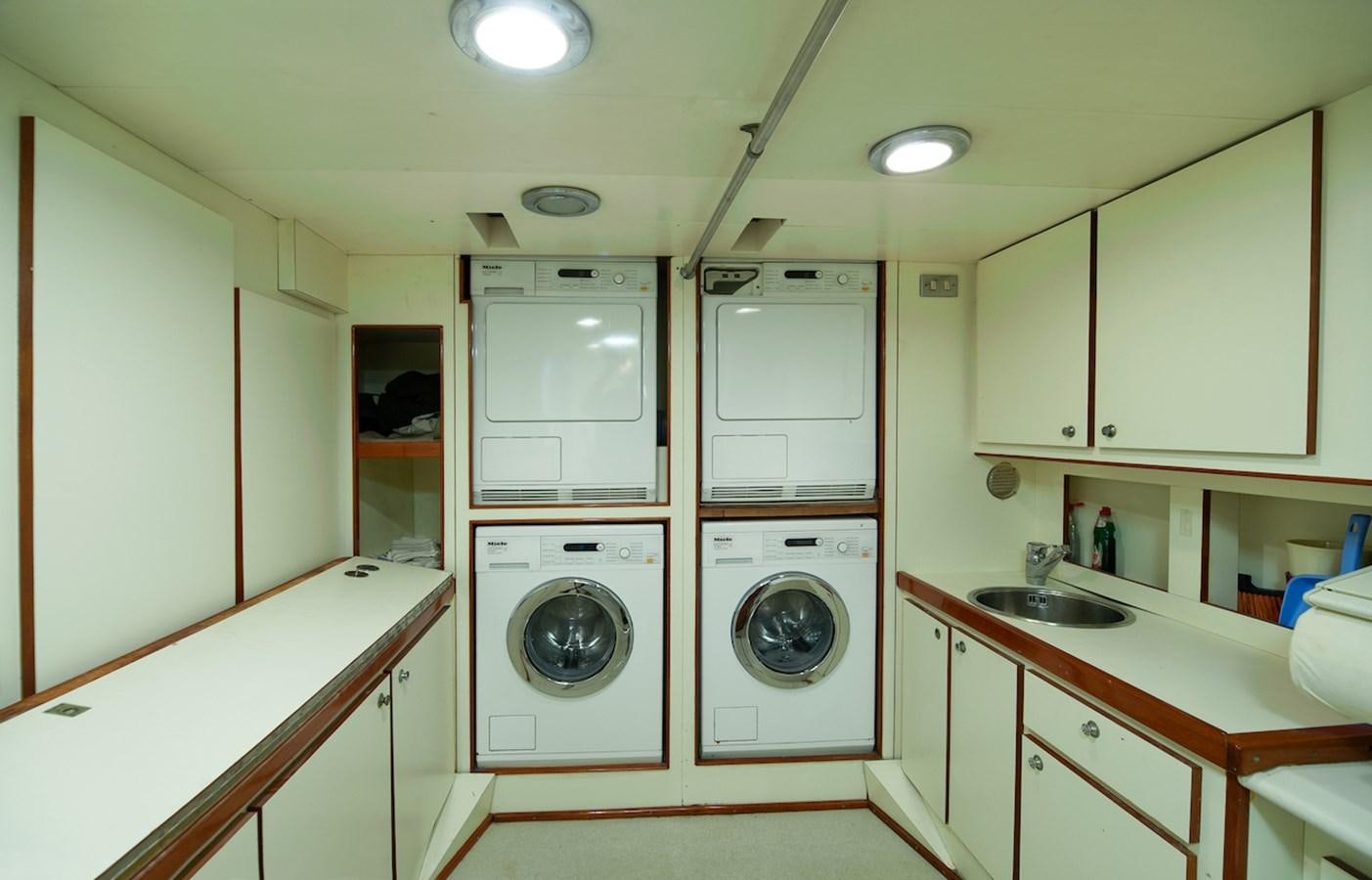 a washer and dryer in a kitchen aboard BELLE BRISE Yacht for Sale