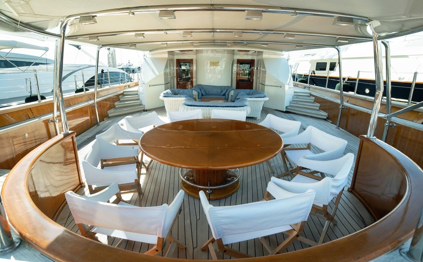 a room with tables and chairs aboard BELLE BRISE Yacht for Sale