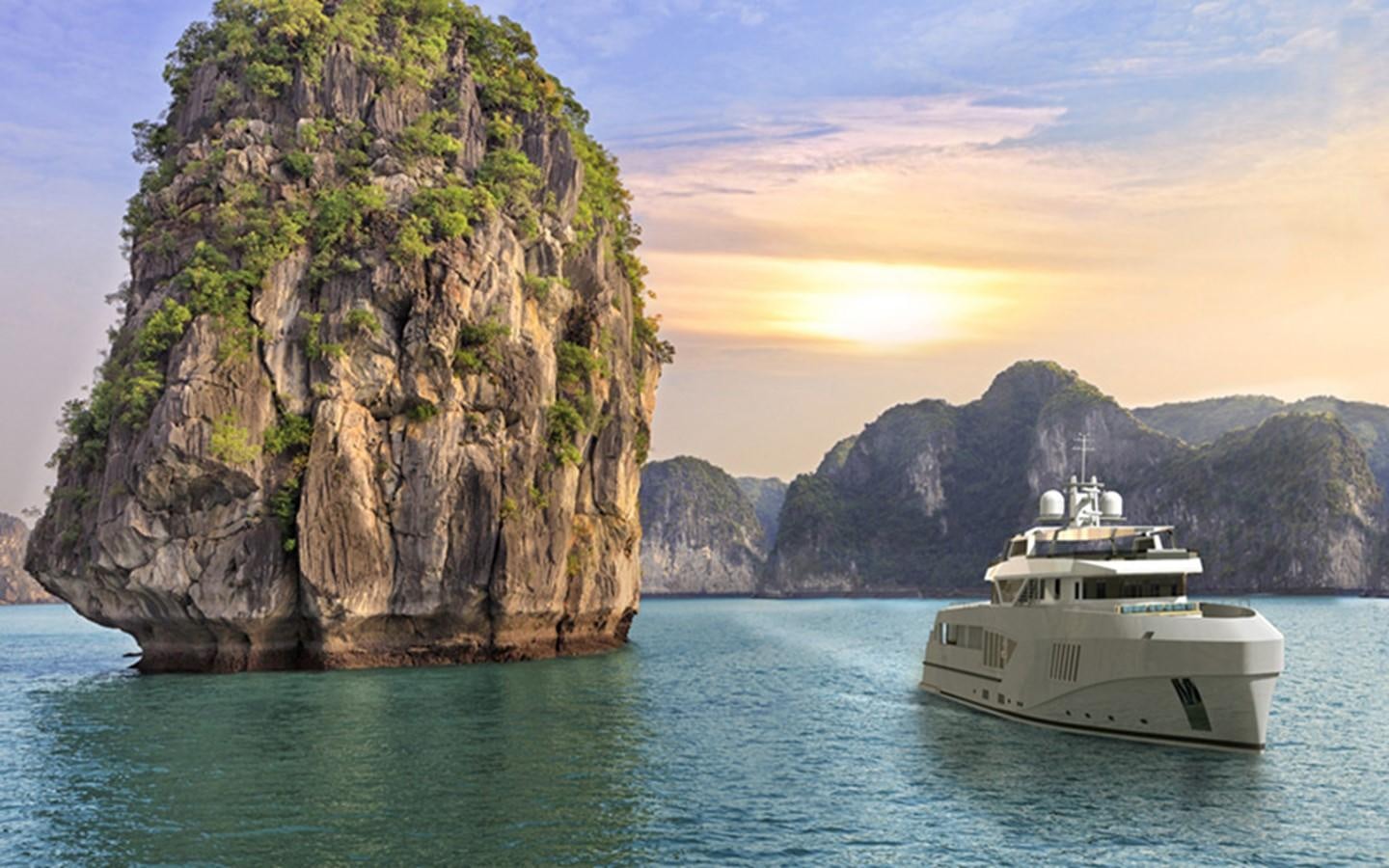 a boat in the water with Ha Long Bay in the background aboard CAPE HAWK 690 Yacht for Sale