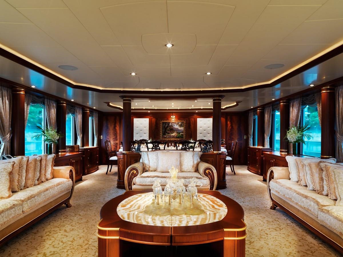 a living room with a fireplace aboard AQUAMARINA Yacht for Sale