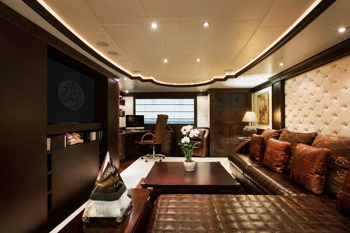 a living room with a large tv aboard AQUAMARINA Yacht for Sale