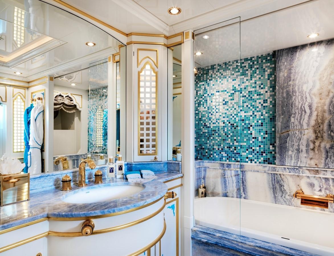 a bathroom with a large mirror aboard AQUAMARINA Yacht for Sale