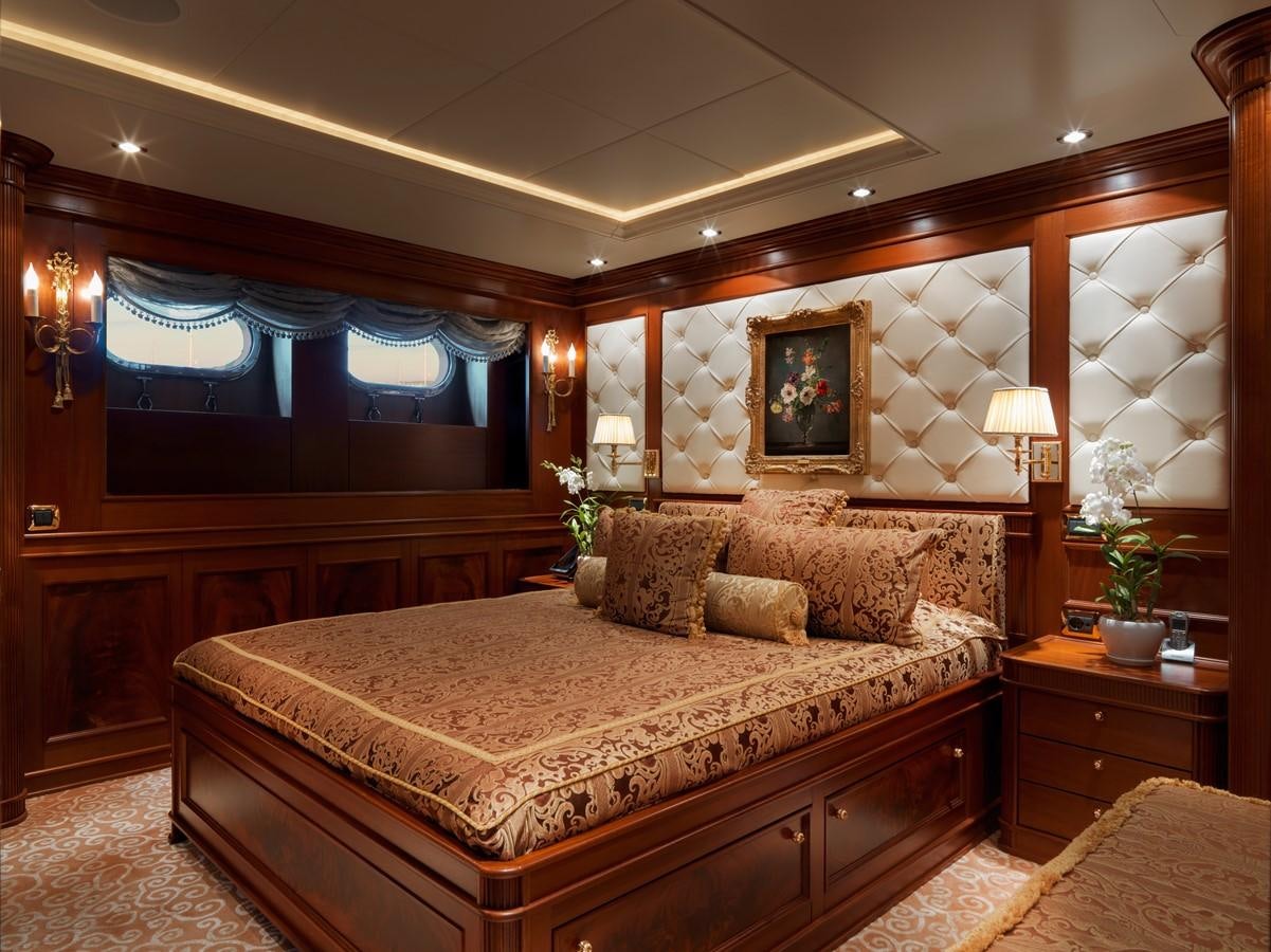 a large bed in a room aboard AQUAMARINA Yacht for Sale