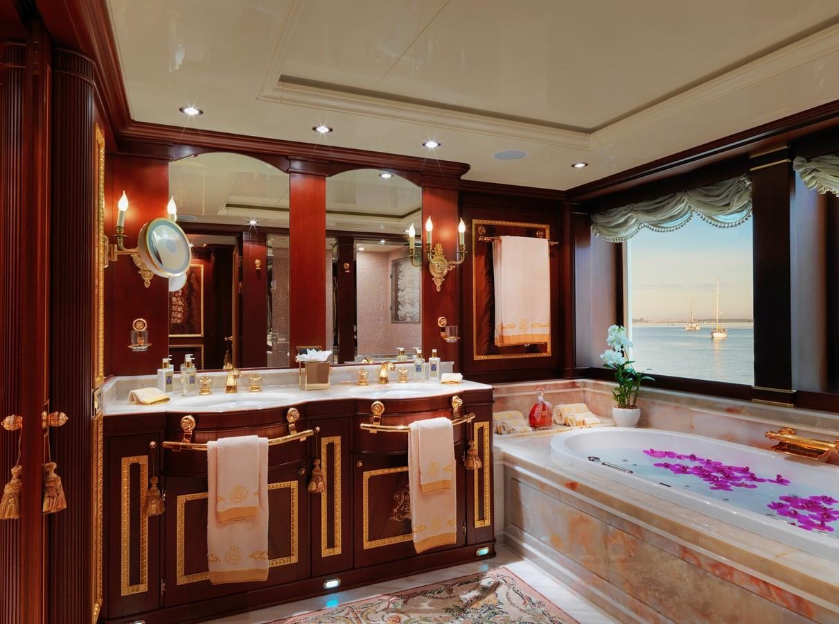a bathroom with a tub sink and cabinets aboard AQUAMARINA Yacht for Sale