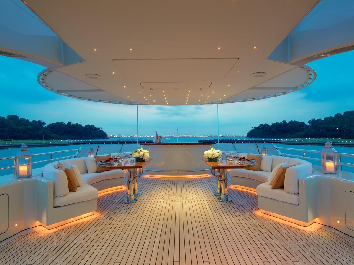 a large living room with a large pool and a large patio aboard AQUAMARINA Yacht for Sale