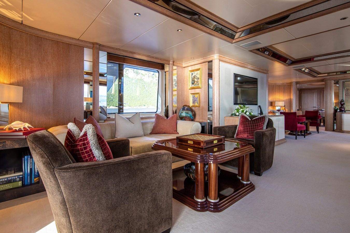 a living room with a couch and a table aboard VA BENE Yacht for Sale
