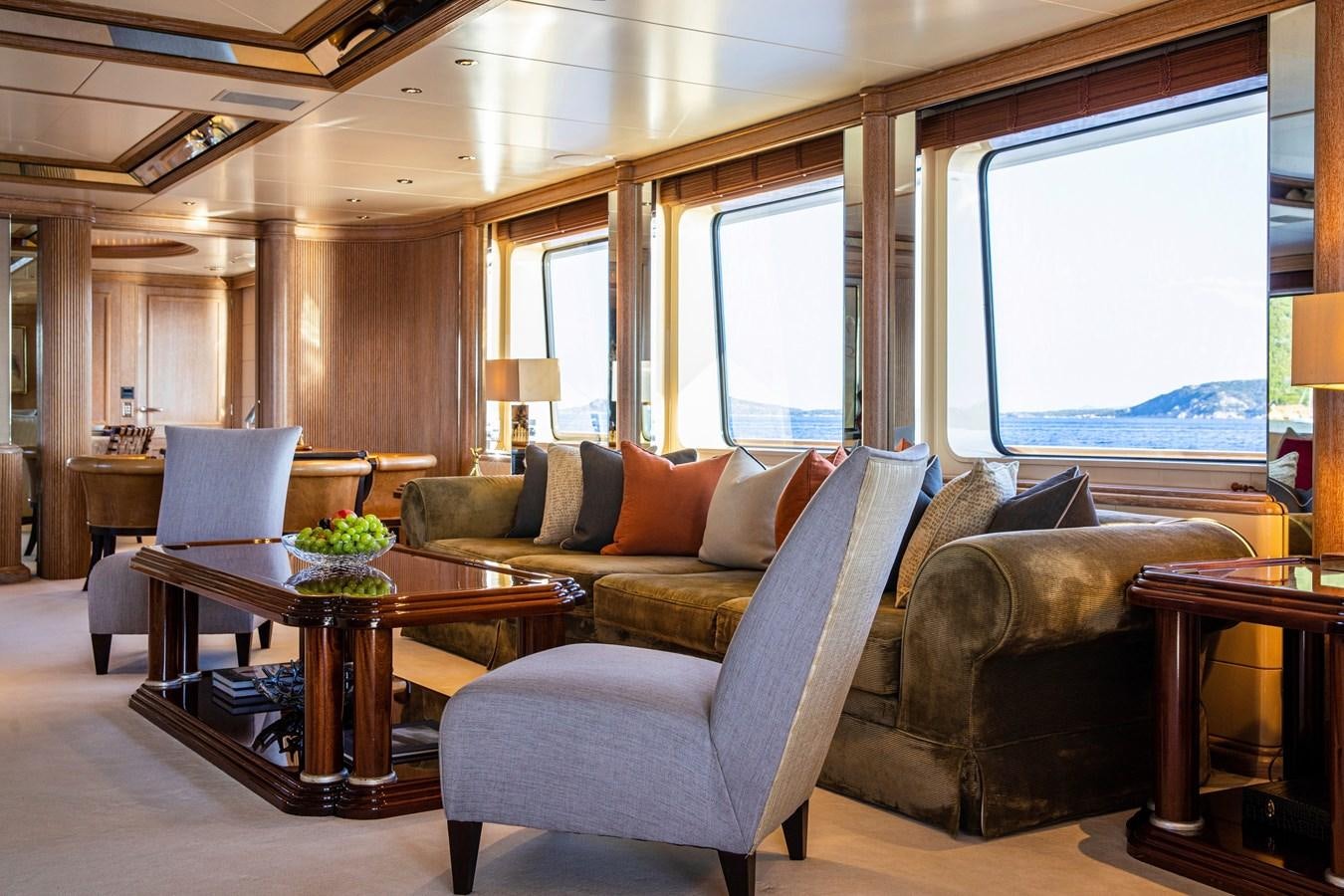 a living room with a couch and a table aboard VA BENE Yacht for Sale