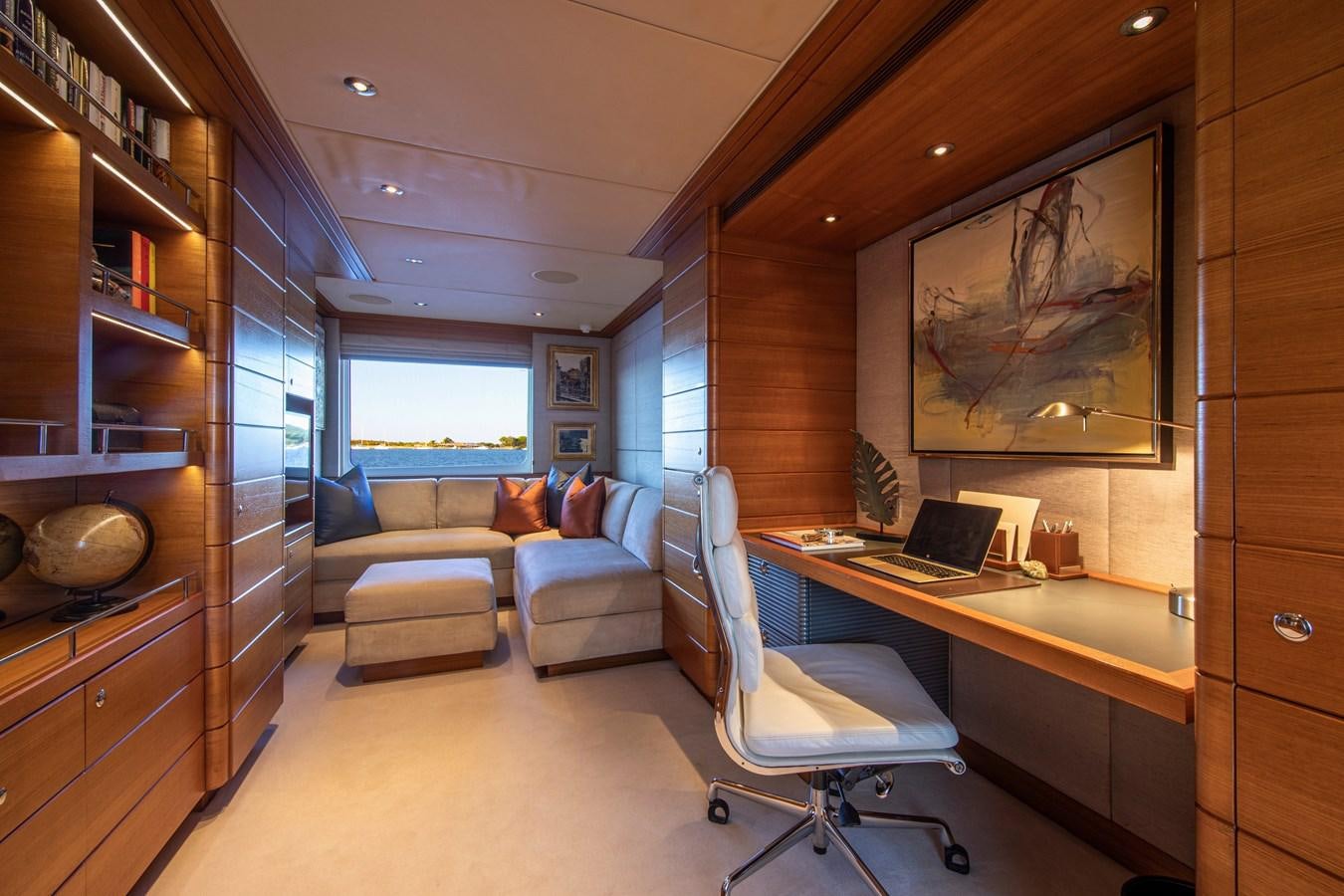 a room with a desk and a chair aboard VA BENE Yacht for Sale