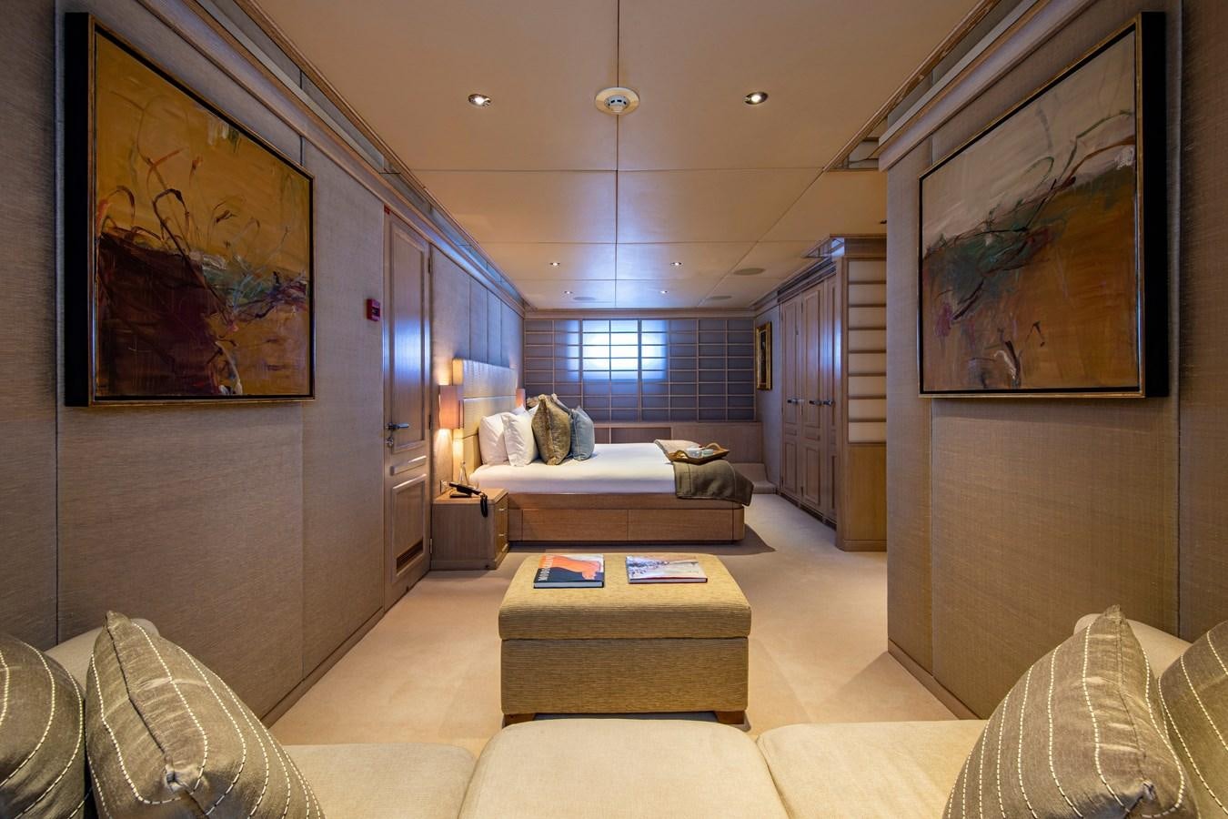 a living room with a couch and a rug aboard VA BENE Yacht for Sale