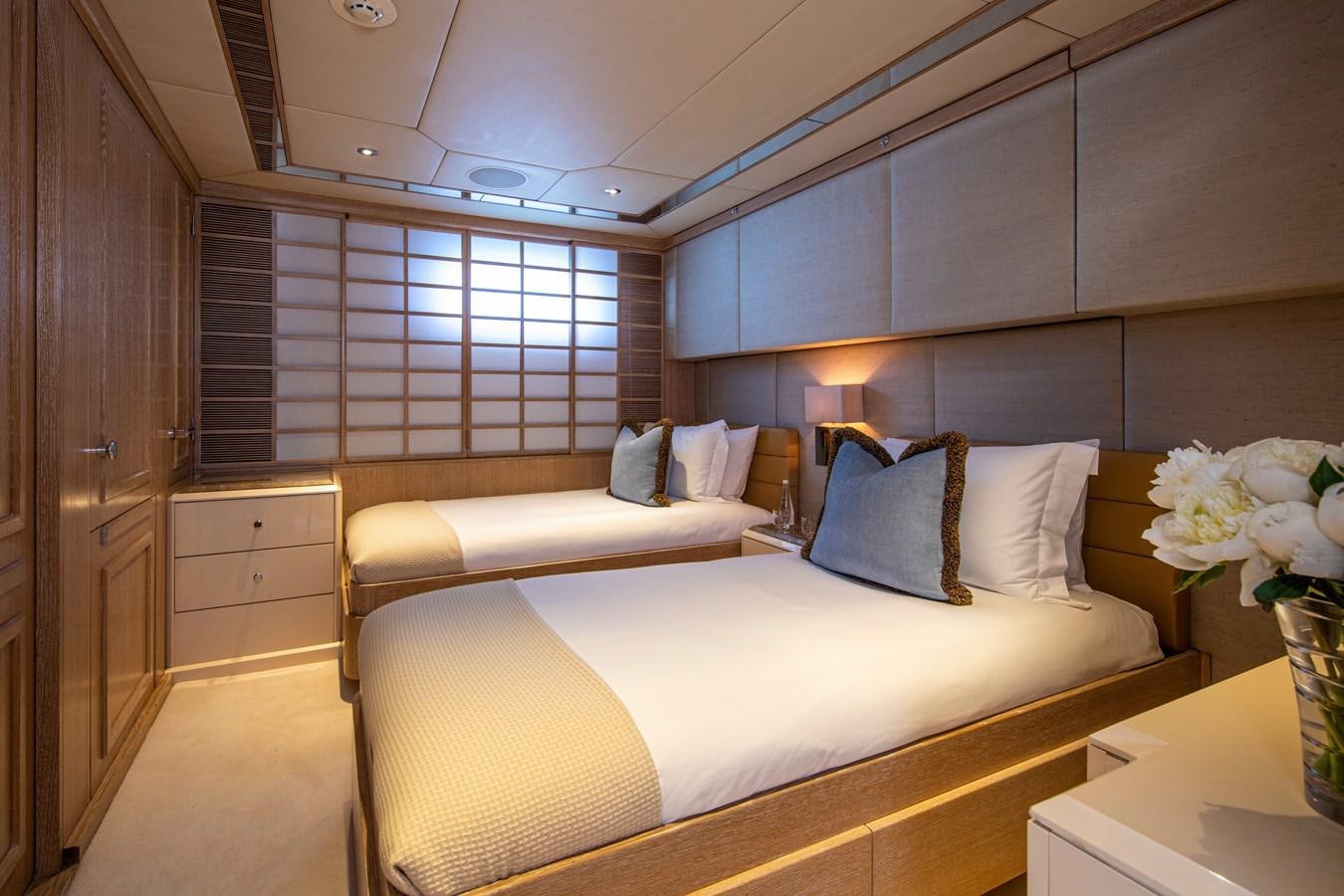 a room with a bed and a desk aboard VA BENE Yacht for Sale