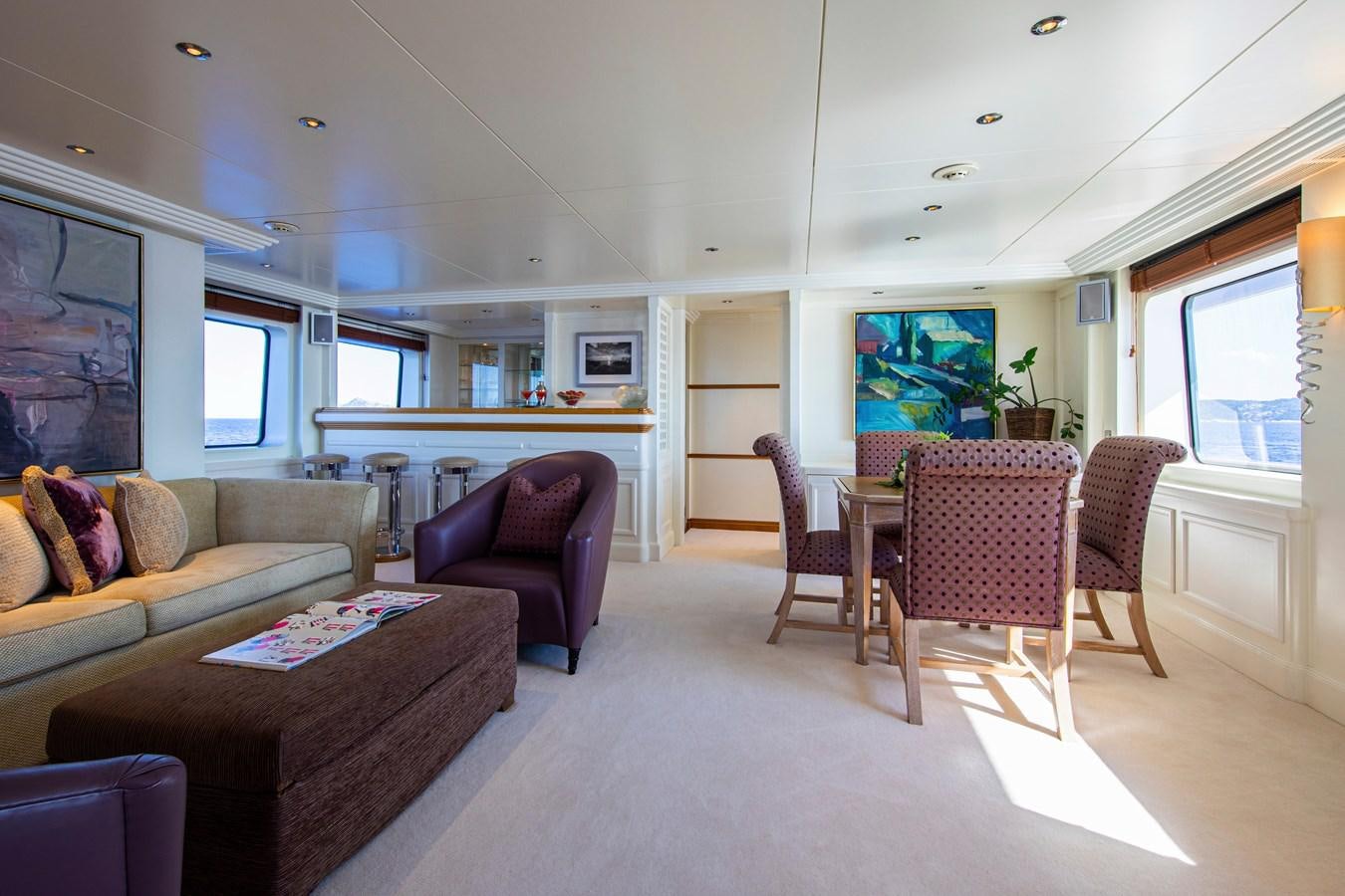 a living room with a couch and chairs aboard VA BENE Yacht for Sale