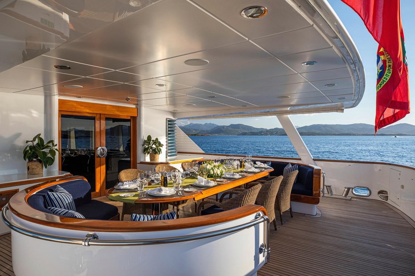 a room with a table and chairs aboard VA BENE Yacht for Sale