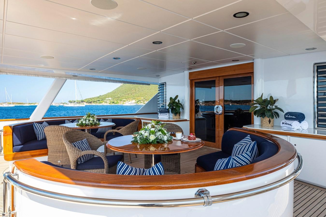 a living room with a large patio aboard VA BENE Yacht for Sale