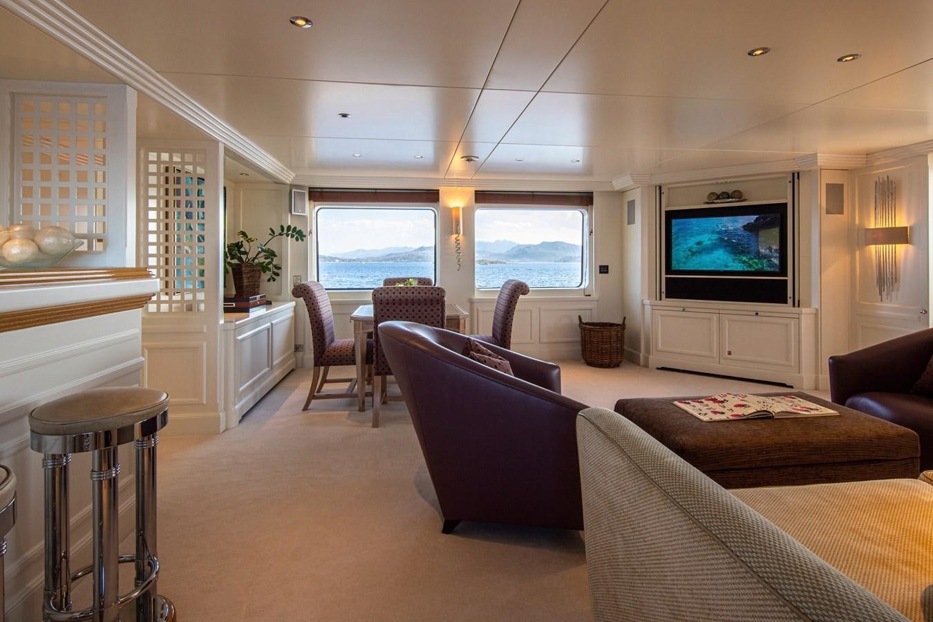 a living room with a large window aboard VA BENE Yacht for Sale