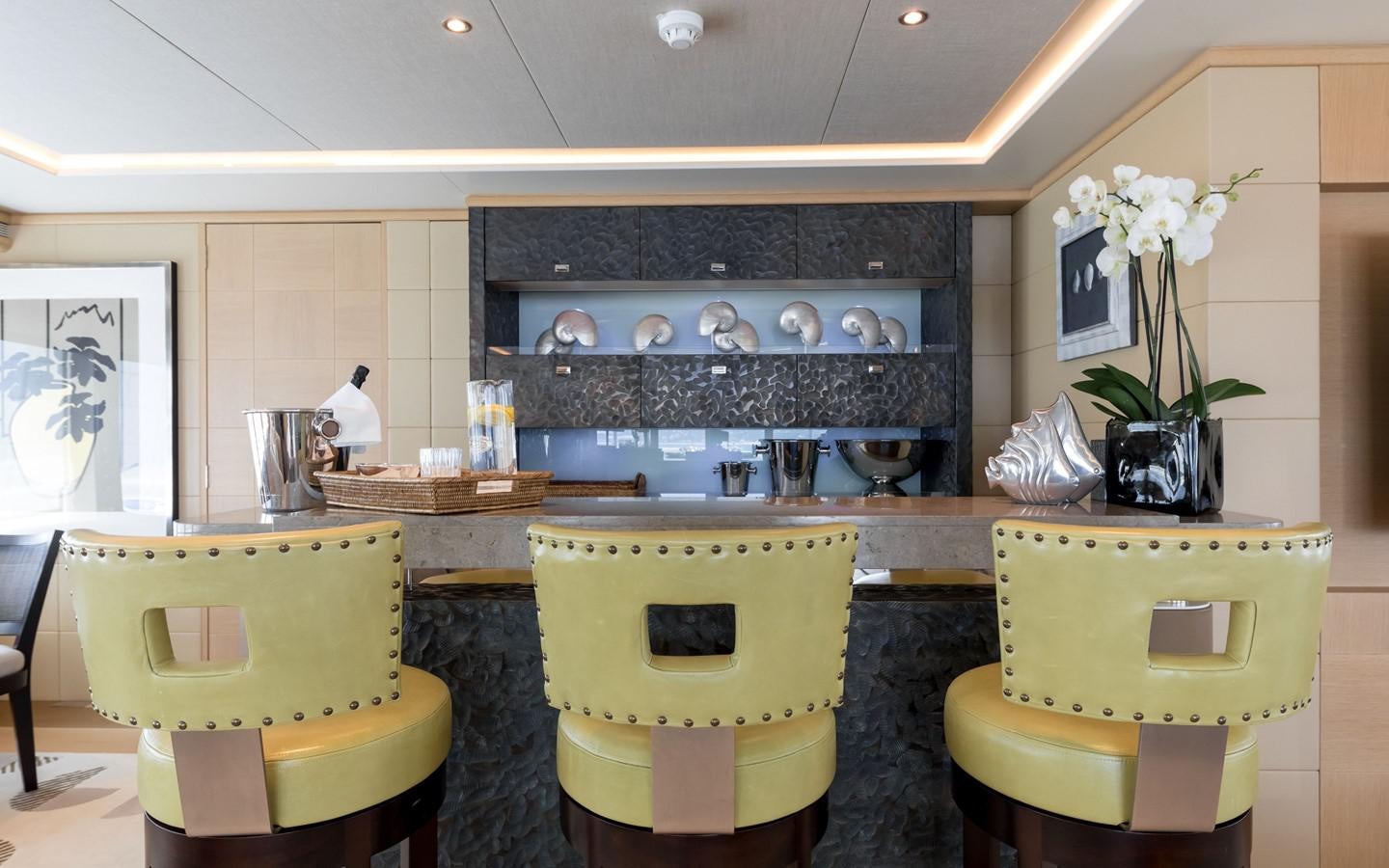 a kitchen with a fireplace aboard ATINA Yacht for Sale