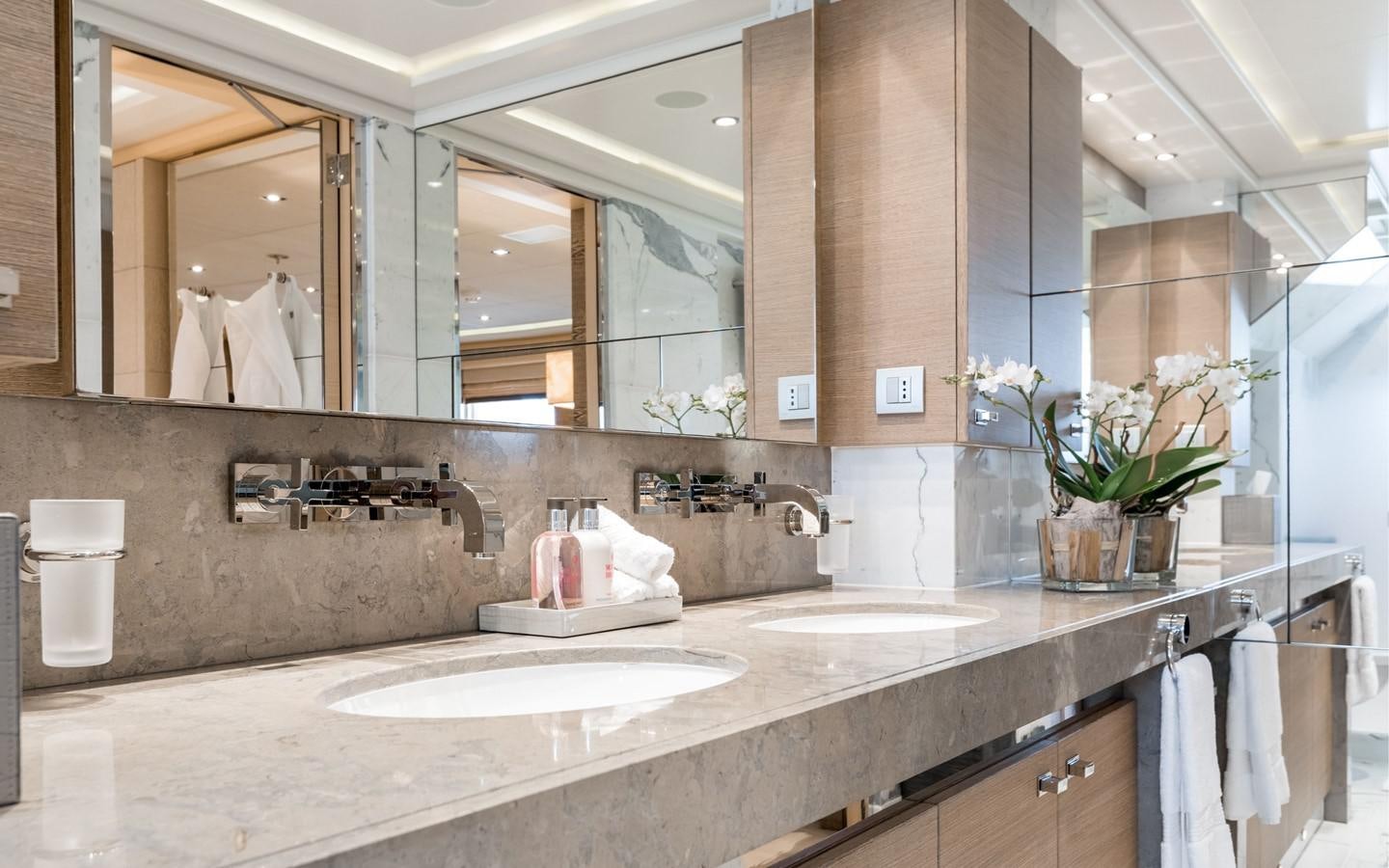 a bathroom with a large countertop aboard ATINA Yacht for Sale