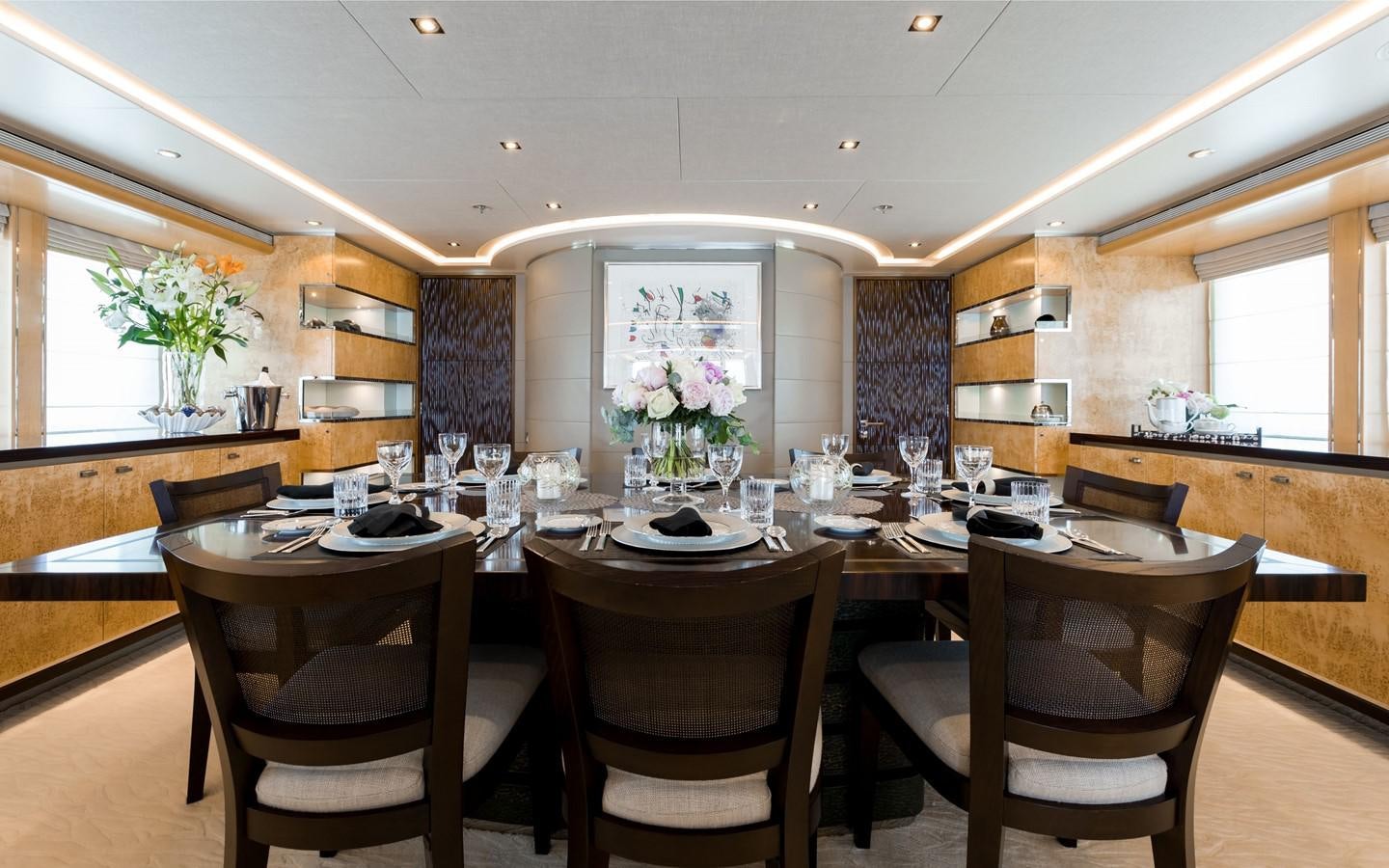 a kitchen with a dining table aboard ATINA Yacht for Sale