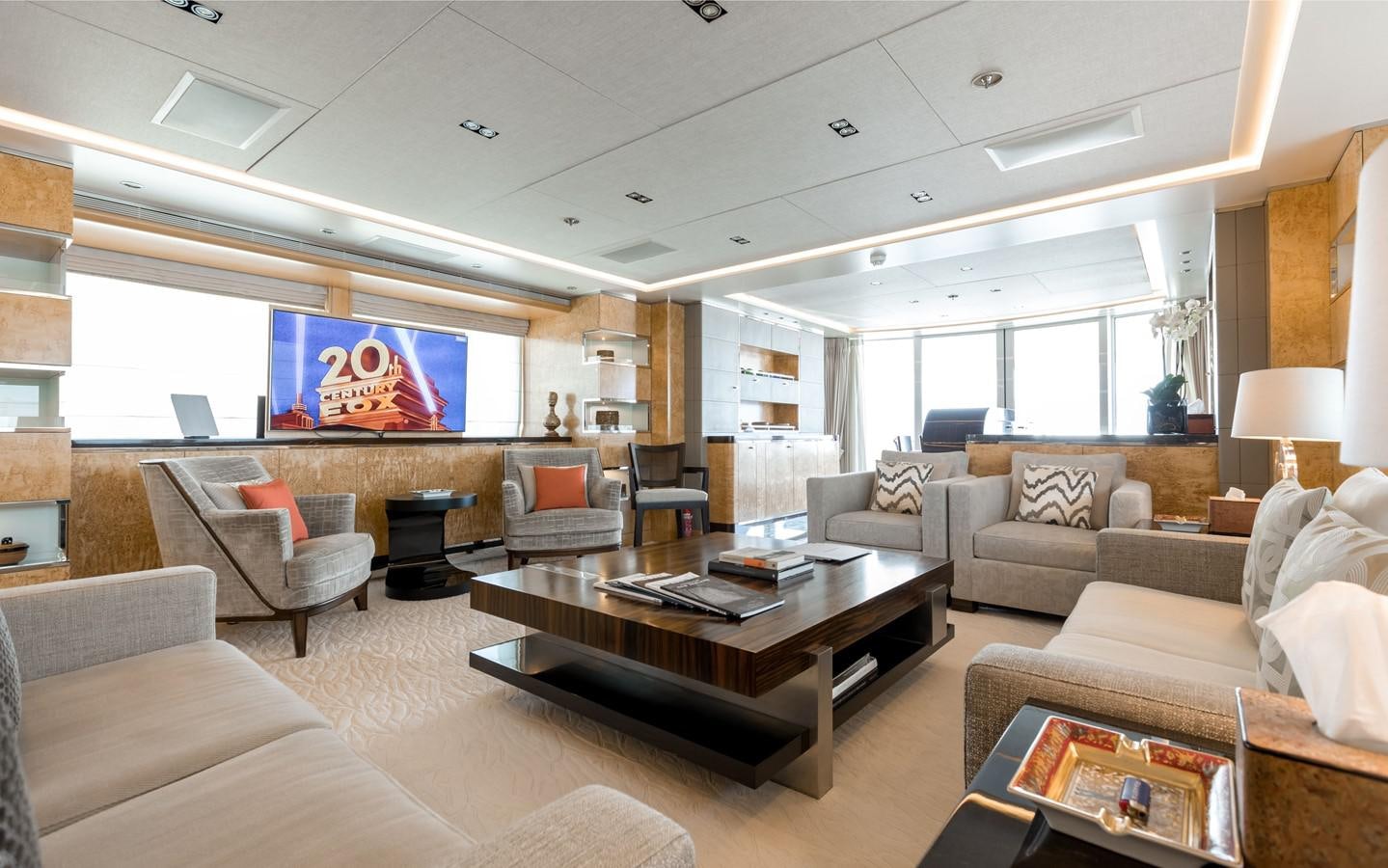 a living room with a large window aboard ATINA Yacht for Sale