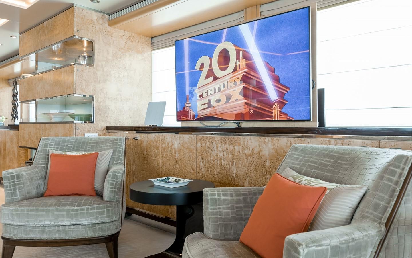 a room with couches and a tv aboard ATINA Yacht for Sale