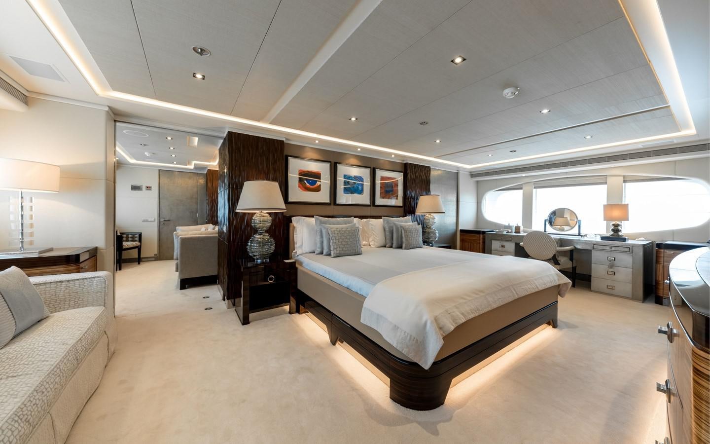 a large bedroom with a large bed aboard ATINA Yacht for Sale