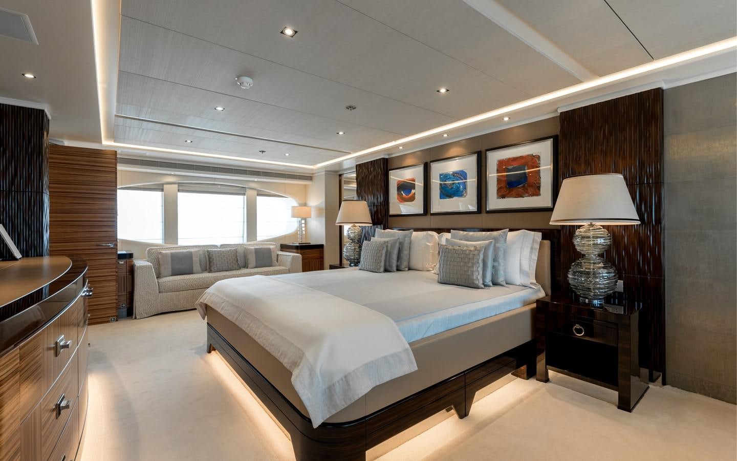 a large bedroom with a large bed aboard ATINA Yacht for Sale