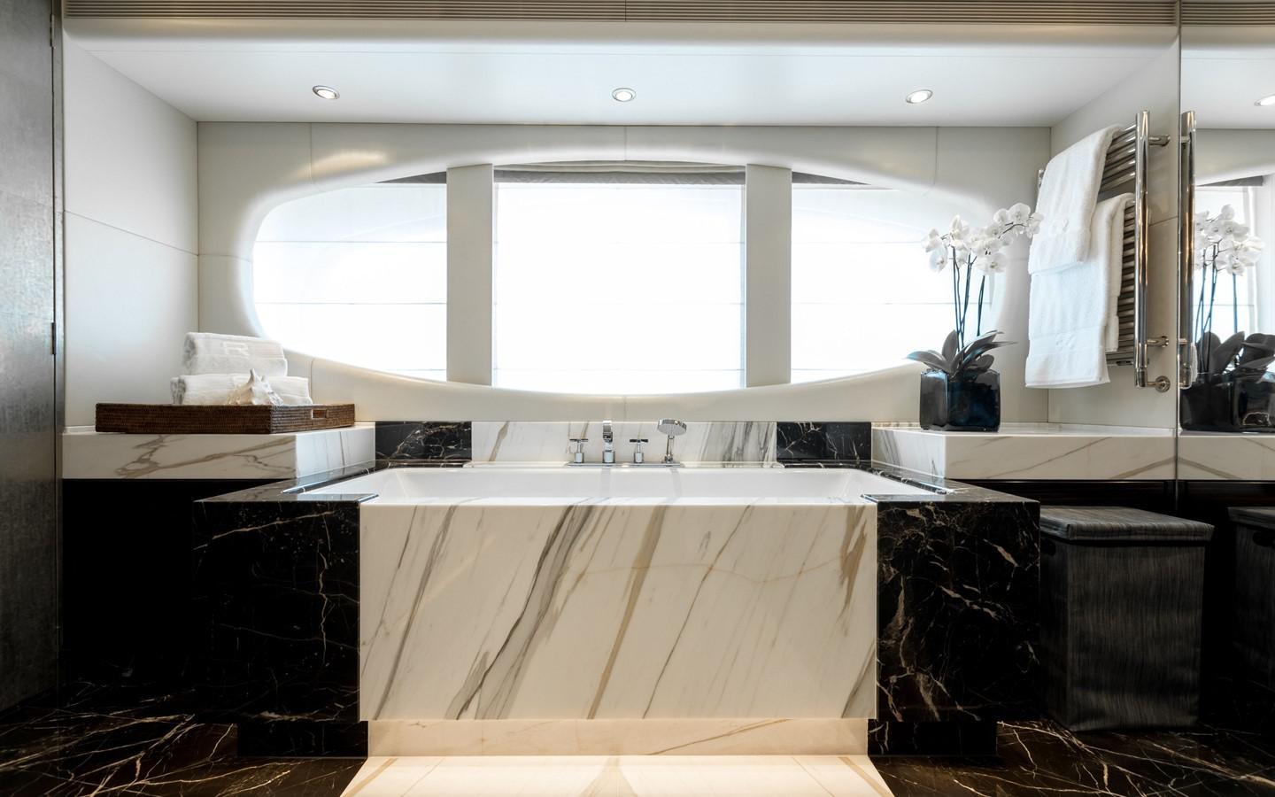 a kitchen with a large window aboard ATINA Yacht for Sale