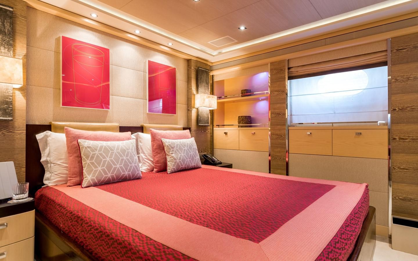 a bed in a room aboard ATINA Yacht for Sale