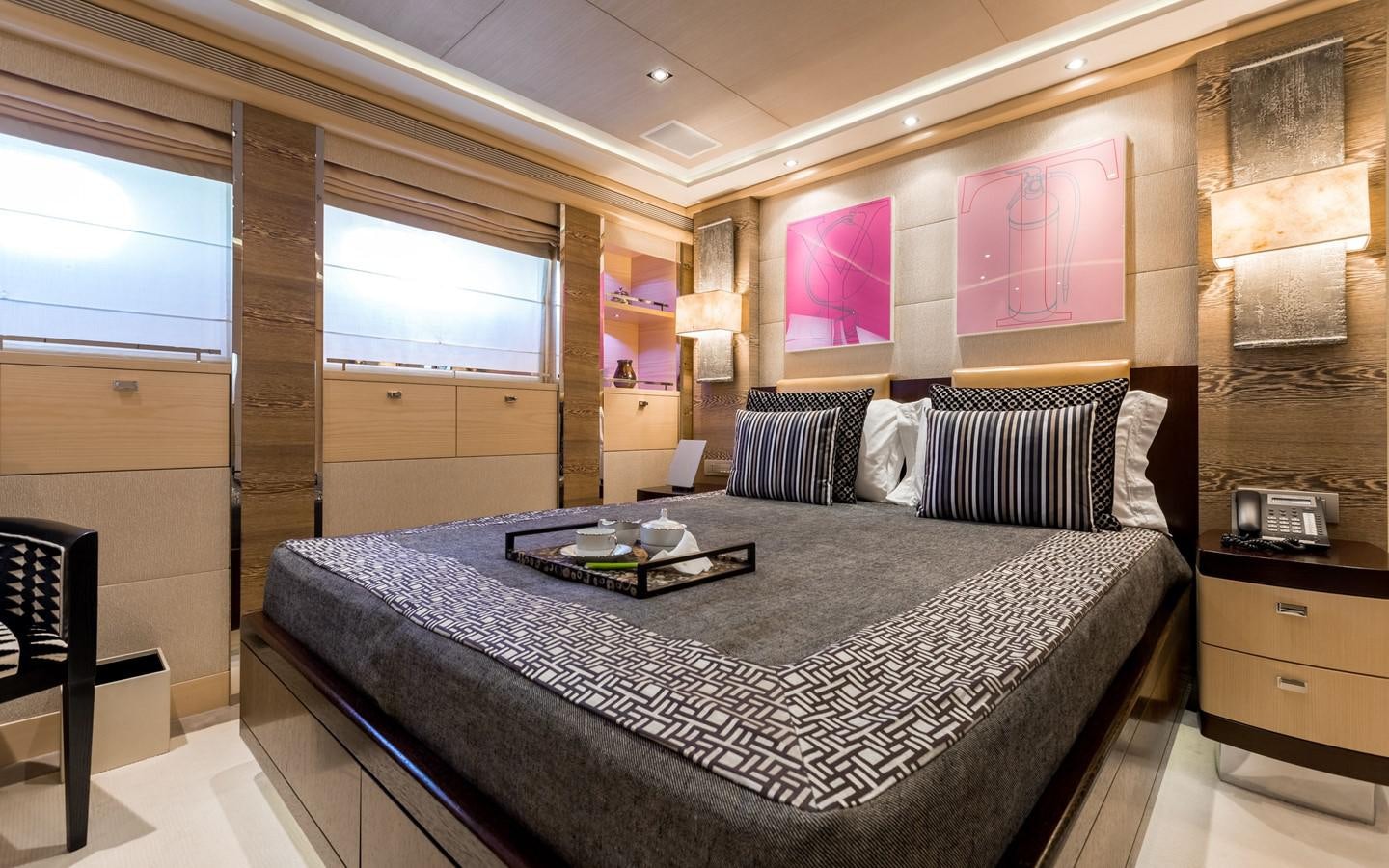 a bed in a room aboard ATINA Yacht for Sale