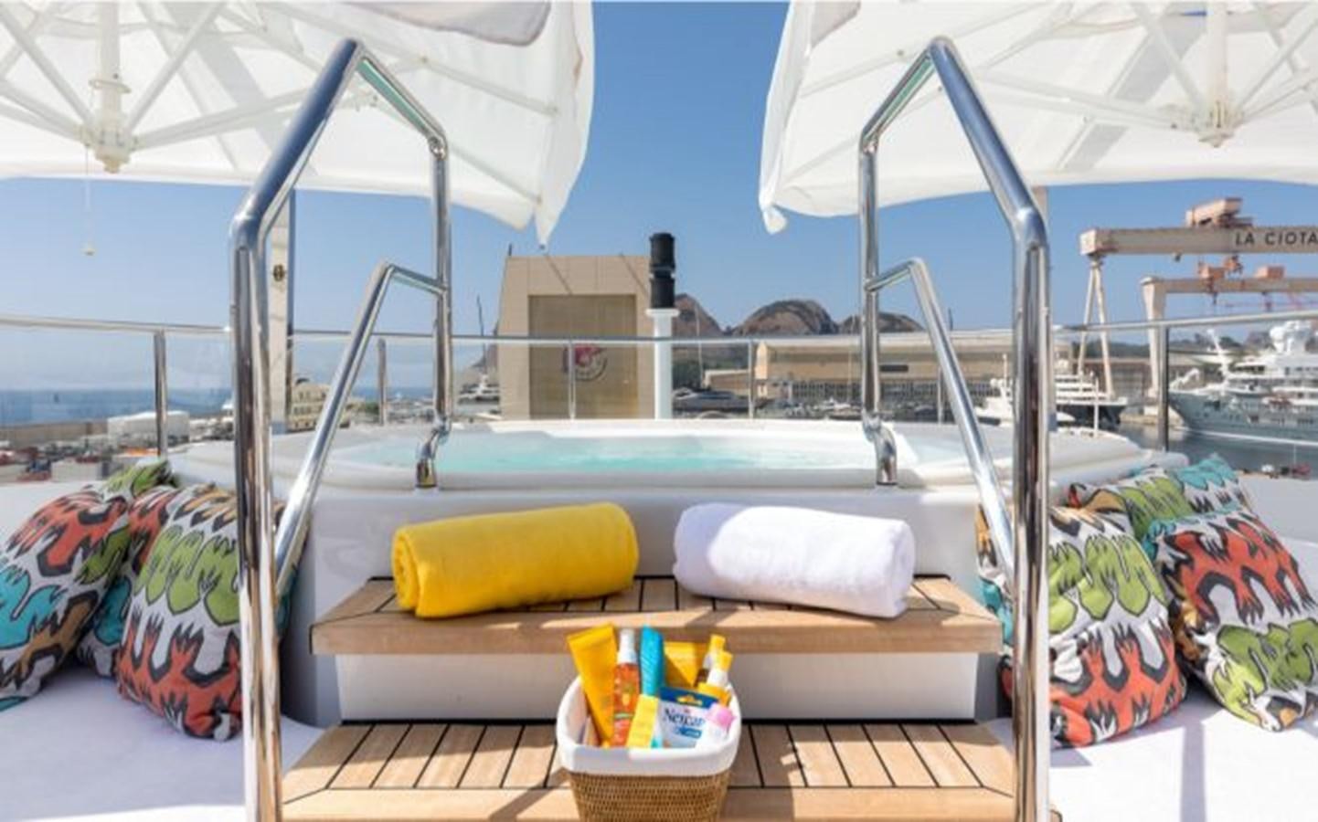 a large white bed on a boat aboard ATINA Yacht for Sale