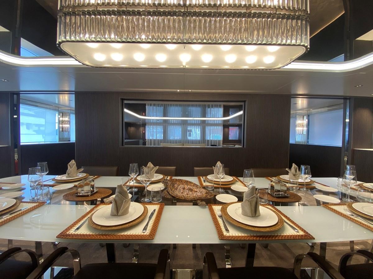 a table with plates and glasses aboard CLOUD ATLAS Yacht for Charter