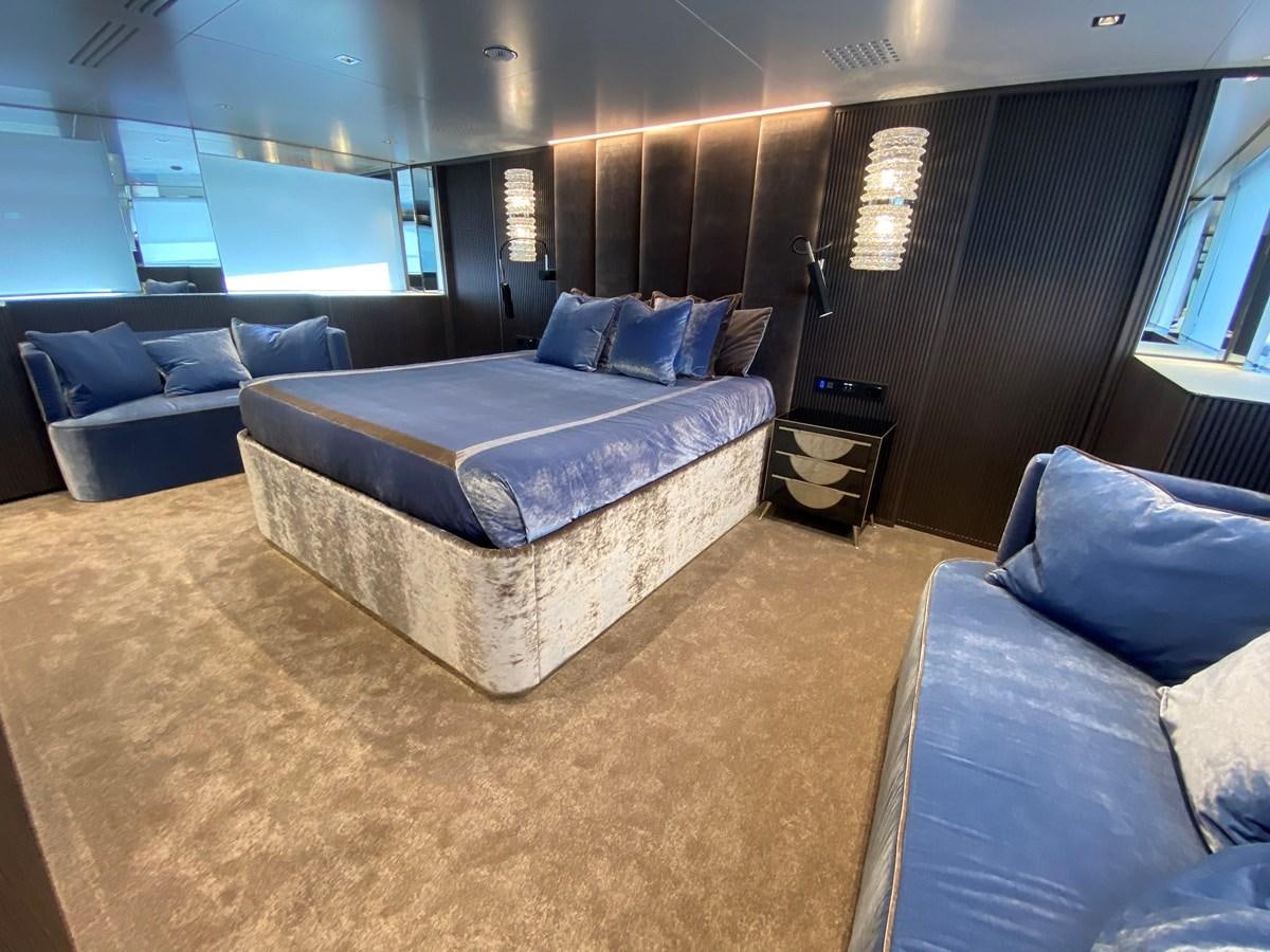 a room with a couch and a television aboard CLOUD ATLAS Yacht for Charter