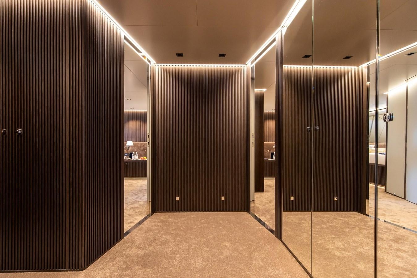 a room with a large black cabinet aboard CLOUD ATLAS Yacht for Charter