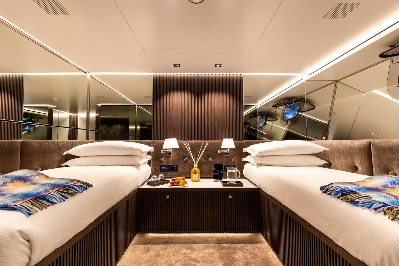 a room with two beds aboard CLOUD ATLAS Yacht for Charter