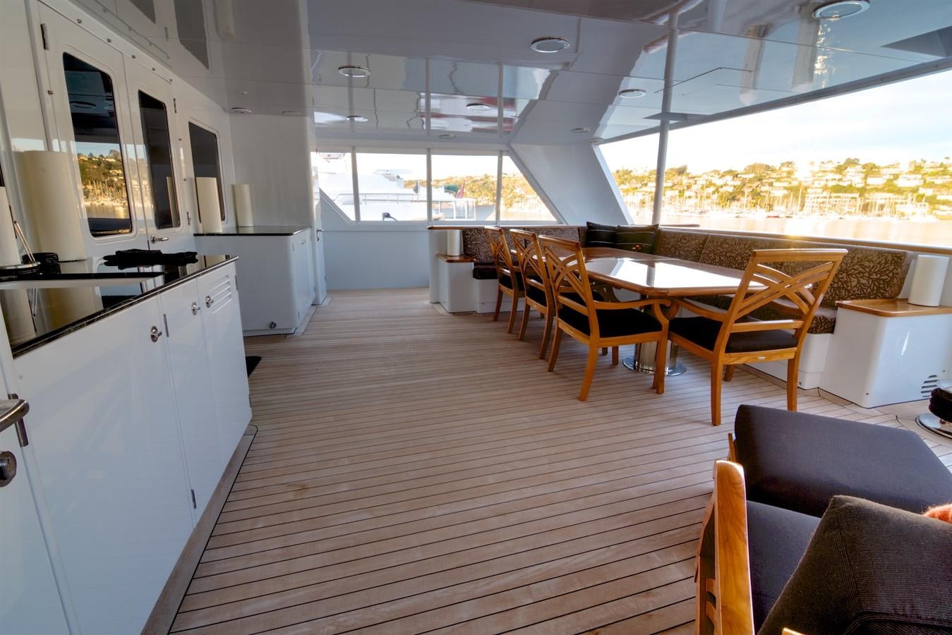 a room with tables and chairs aboard SCORPIO Yacht for Sale