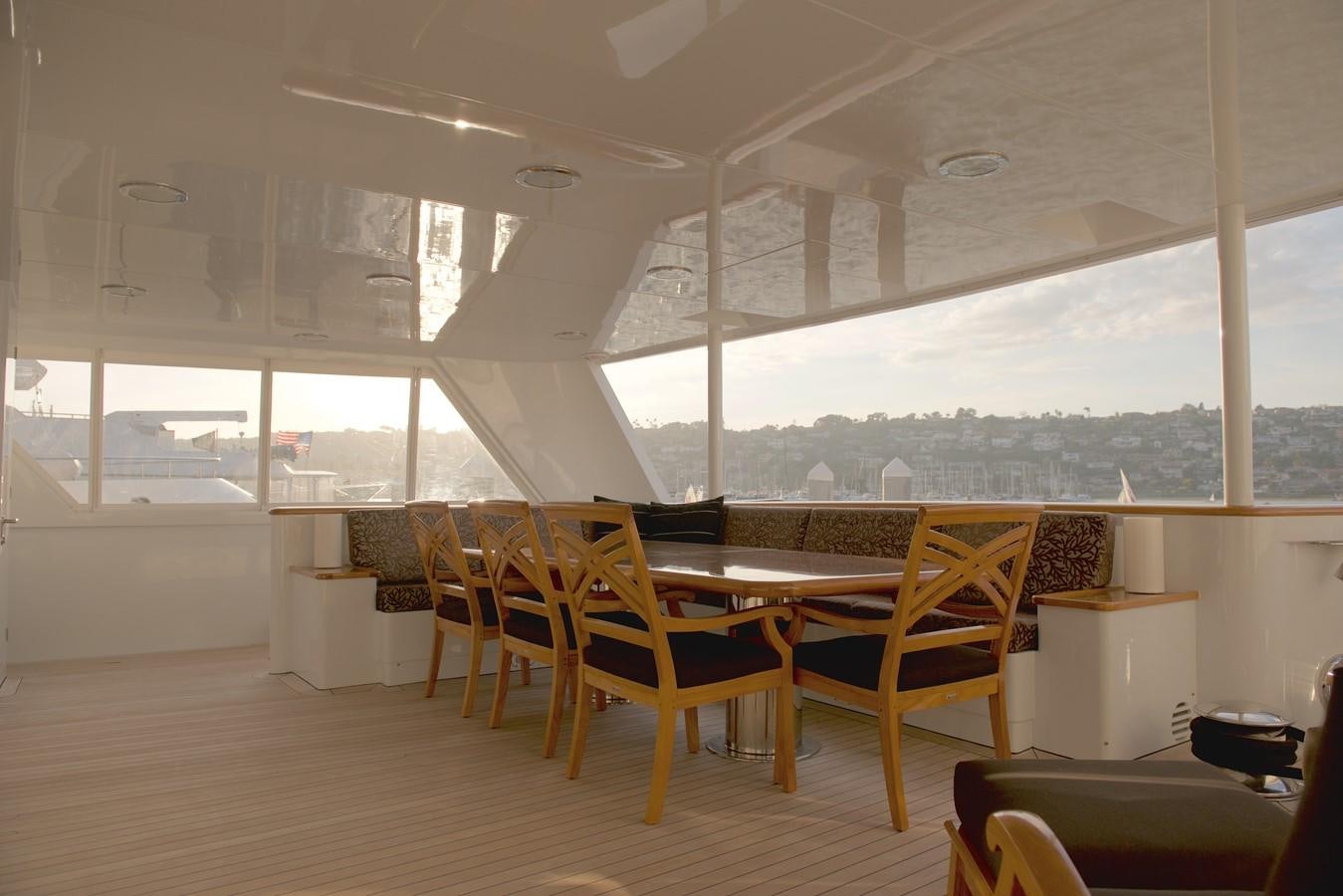 a room with tables and chairs aboard SCORPIO Yacht for Sale