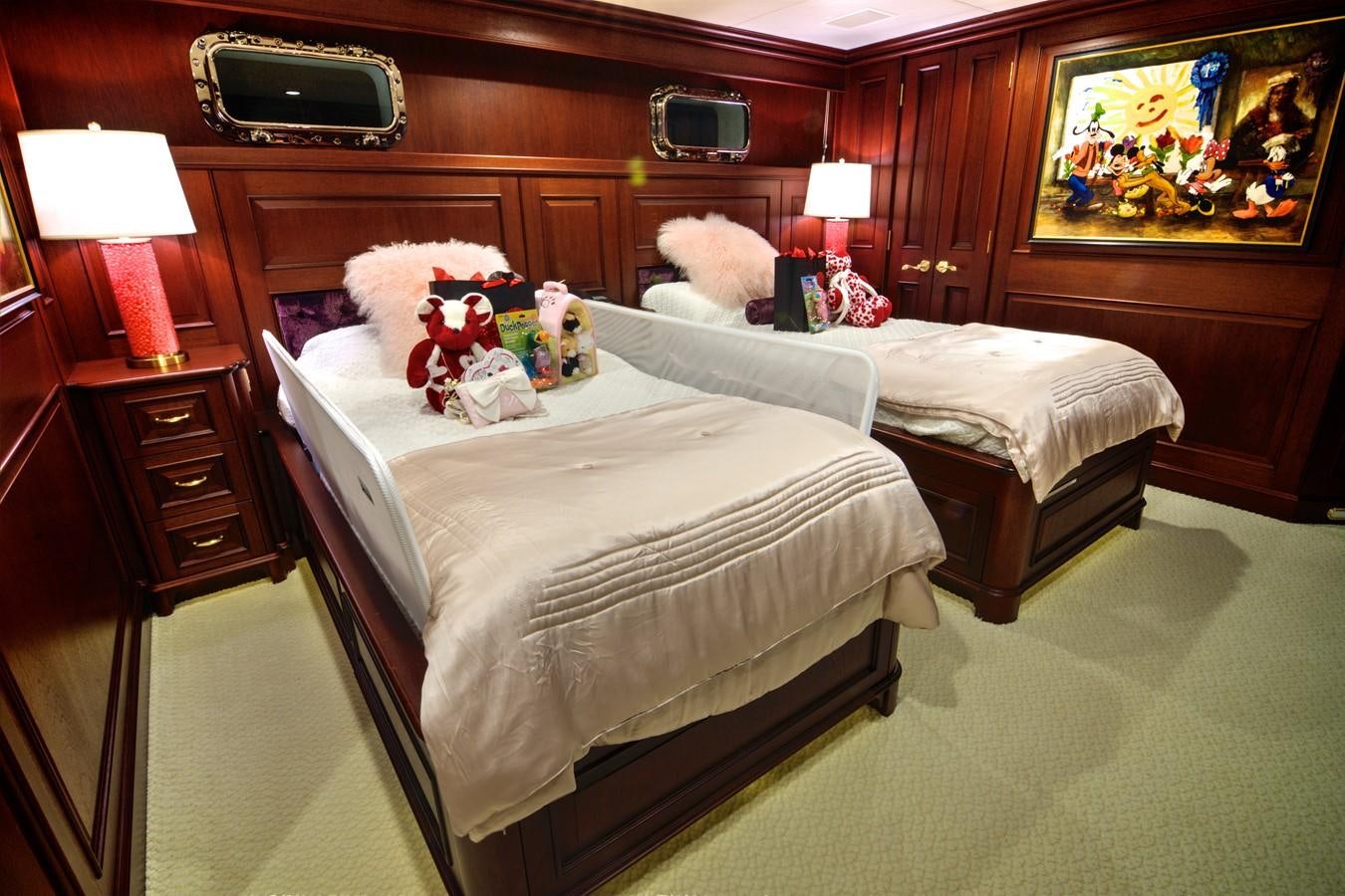 a bedroom with a bed and a television aboard SCORPIO Yacht for Sale
